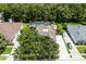 Aerial view showing the home's backyard pool, solar panels, and driveway at 806 Spring Island Way, Orlando, FL 32828