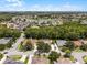 Aerial view of the home showing the pool, screened-in porch, and proximity to the lake at 806 Spring Island Way, Orlando, FL 32828