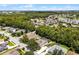 Overhead view of this home with a pool, solar panels, landscaping, and a view of the lake at 806 Spring Island Way, Orlando, FL 32828