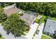 Overhead view of this home showing the driveway, yard, solar panels and screened-in pool at 806 Spring Island Way, Orlando, FL 32828