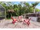 Outdoor backyard patio with a stone fire pit and seating at 806 Spring Island Way, Orlando, FL 32828