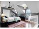 Inviting bedroom boasts vaulted ceilings, hardwood floors, and ample natural light from multiple windows at 806 Spring Island Way, Orlando, FL 32828