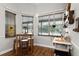 Cozy breakfast nook with natural light, seating for four, and a charming, rustic bar area at 806 Spring Island Way, Orlando, FL 32828