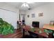 Functional home office with wood floors, a ceiling fan, and two desks, perfect for productivity at 806 Spring Island Way, Orlando, FL 32828
