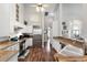 Spacious kitchen with granite countertops, stainless appliances, and hardwood flooring at 806 Spring Island Way, Orlando, FL 32828