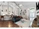 Spacious open concept living room and kitchen with bar seating and hardwood floors at 806 Spring Island Way, Orlando, FL 32828