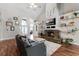 Cozy living room with fireplace, hardwood floors, and vaulted ceiling at 806 Spring Island Way, Orlando, FL 32828