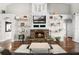 Inviting living room featuring a stone fireplace and decorative shelving at 806 Spring Island Way, Orlando, FL 32828