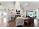 Bright living room with fireplace, vaulted ceiling, and access to outdoor patio at 806 Spring Island Way, Orlando, FL 32828