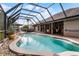 Relaxing screened in pool with outdoor seating and lounging furniture perfect for entertaining at 806 Spring Island Way, Orlando, FL 32828