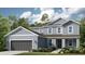 Charming two-story home with attached two-car garage, landscaped front yard, and a covered front entryway at 862 Junonia Blvd, New Smyrna Beach, FL 32168