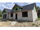 Exterior block construction showing zip system, roof and window openings during the building process at 9659 Midway Rd, Haines City, FL 33844