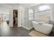 Modern bath featuring glass shower and soaking tub at 985 N Lake Claire Cir, Oviedo, FL 32765