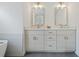 Bathroom with double vanity, stone countertops, and modern lighting at 985 N Lake Claire Cir, Oviedo, FL 32765