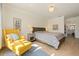 Inviting bedroom with seating area and adjoining bath at 985 N Lake Claire Cir, Oviedo, FL 32765