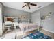 Cozy bedroom with bright natural light, desk, and ample closet space at 985 N Lake Claire Cir, Oviedo, FL 32765
