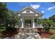 Beautiful gazebo with white columns and brick base, surrounded by lush landscaping and a sunny sky at 985 N Lake Claire Cir, Oviedo, FL 32765