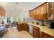 Open kitchen with granite countertops, stainless steel appliances, and seamless flow into the dining and living areas at 985 N Lake Claire Cir, Oviedo, FL 32765