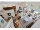 Aerial view of a bright, open living room with high ceilings, a piano, and a view of the pool at 985 N Lake Claire Cir, Oviedo, FL 32765