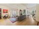 Spacious living room with neutral decor, an area rug, and seamless transition to the open floor plan at 985 N Lake Claire Cir, Oviedo, FL 32765