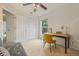 Bright office space with a cozy seating area and ample storage at 985 N Lake Claire Cir, Oviedo, FL 32765