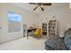 Comfortable office space with natural light and a cozy couch for relaxing at 985 N Lake Claire Cir, Oviedo, FL 32765
