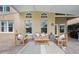 Covered patio area with comfortable seating, perfect for outdoor relaxation at 985 N Lake Claire Cir, Oviedo, FL 32765
