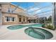 Relaxing pool and spa area, screened in for privacy, with adjacent patio at 985 N Lake Claire Cir, Oviedo, FL 32765