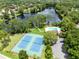 Community amenities including a pool, tennis courts, and lake access surrounded by lush landscaping at 102 Sand Pine Cir, Sanford, FL 32773