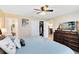Comfortable bedroom featuring closet, en-suite bathroom, and mounted television at 102 Sand Pine Cir, Sanford, FL 32773