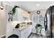 Well-lit kitchen featuring white cabinets, granite countertops and a window at 102 Sand Pine Cir, Sanford, FL 32773