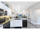Modern kitchen featuring granite countertops, stainless steel appliances, and an open layout at 102 Sand Pine Cir, Sanford, FL 32773