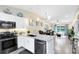 Modern kitchen featuring granite countertops, stainless steel appliances, and an open layout at 102 Sand Pine Cir, Sanford, FL 32773
