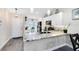 Bright kitchen with white cabinets, granite countertops, and updated appliances at 102 Sand Pine Cir, Sanford, FL 32773