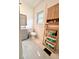 Bright bathroom featuring tiled floor, vanity and shelving for storage at 112 Avocado Ave, Sanford, FL 32771