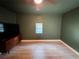 This bedroom features neutral-painted walls and a ceiling fan, creating a cozy atmosphere at 112 Avocado Ave, Sanford, FL 32771
