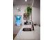 Bright, clean kitchen with quartz countertops, stainless faucet, and decorative hanging plants at 112 Avocado Ave, Sanford, FL 32771