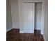 A bedroom closet featuring double doors and a wire rack for storing clothes at 13546 Summerton Dr, Orlando, FL 32824