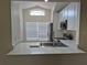 Bright kitchen area with a stainless steel sink, white countertops, and modern appliances, ideal for cooking and entertaining at 13546 Summerton Dr, Orlando, FL 32824