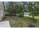 Backyard boasts mature trees and lake views at 13850 Amelia Pond Dr, Windermere, FL 34786