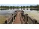 Scenic view of the lake from the community dock, perfect for enjoying the waterfront lifestyle at 13850 Amelia Pond Dr, Windermere, FL 34786