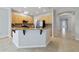 Open kitchen with granite countertops, stainless steel appliances and breakfast bar at 13850 Amelia Pond Dr, Windermere, FL 34786