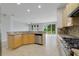 Bright eat-in kitchen with stainless steel appliances and granite counters at 13850 Amelia Pond Dr, Windermere, FL 34786
