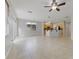 Open concept living area features tile flooring and an eat-in kitchen at 13850 Amelia Pond Dr, Windermere, FL 34786