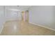 Large living room area featuring tile flooring, modern lighting, and open archways at 13850 Amelia Pond Dr, Windermere, FL 34786