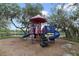 Community playground with a slide and lake view at 13850 Amelia Pond Dr, Windermere, FL 34786