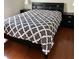 Comfortable bedroom featuring hardwood floors and sleek black furniture at 14147 Mailer Blvd, Orlando, FL 32828
