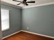 Bedroom with neutral paint, wood flooring, and natural light streaming through the window at 14147 Mailer Blvd, Orlando, FL 32828