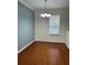 Dining room with hardwood floors, natural light, and a modern chandelier at 14147 Mailer Blvd, Orlando, FL 32828
