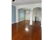 Open-concept living room with hardwood floors and views to the dining area at 14147 Mailer Blvd, Orlando, FL 32828